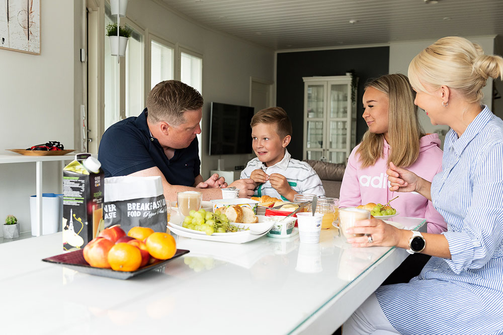 Family eating breakfast together