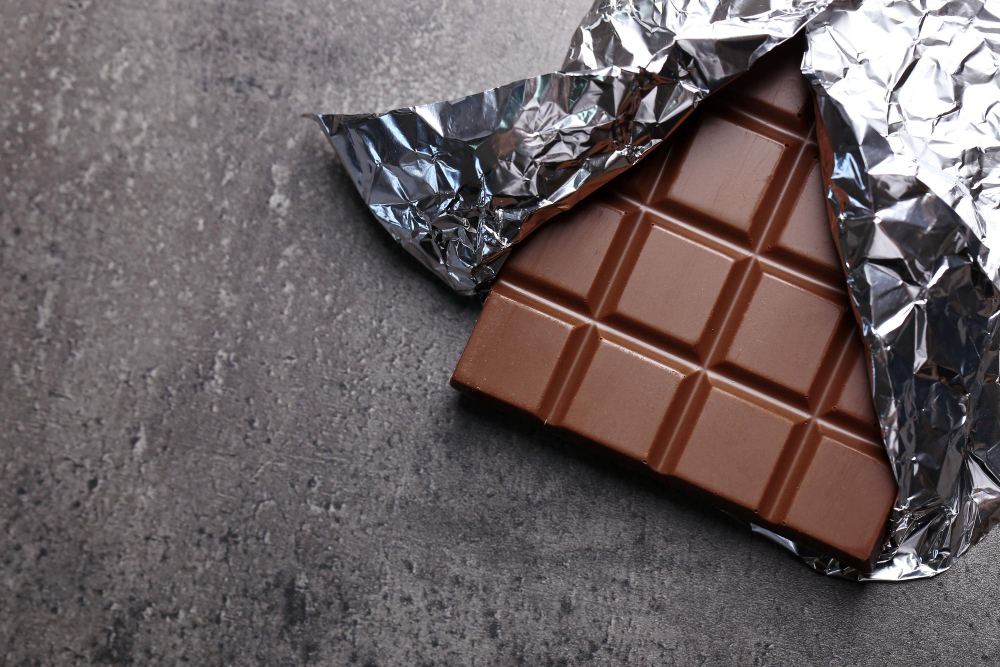 Dark chocolate in a foil wrapper.