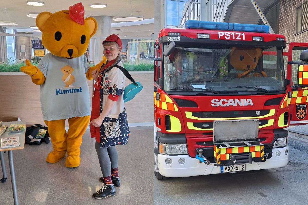 Maskottinalle ja sairaalaklovni sairaalan aulassa sekä paloauton ohjaamossa.